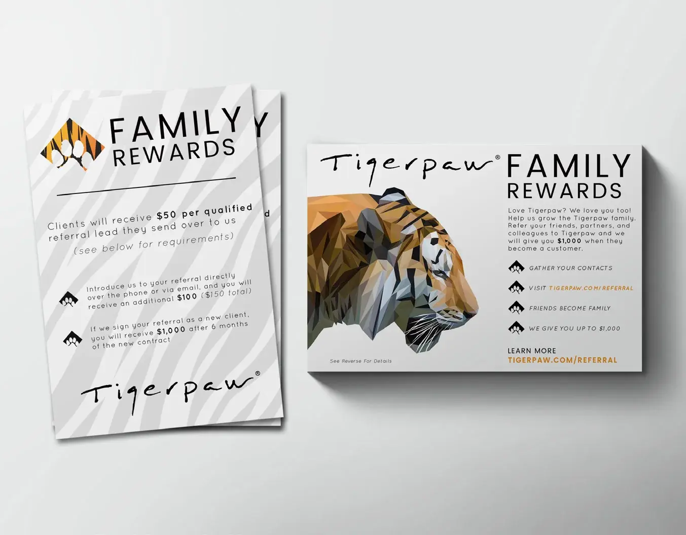 The Family Rewards flyer printed front and back and laid on a gray surface.