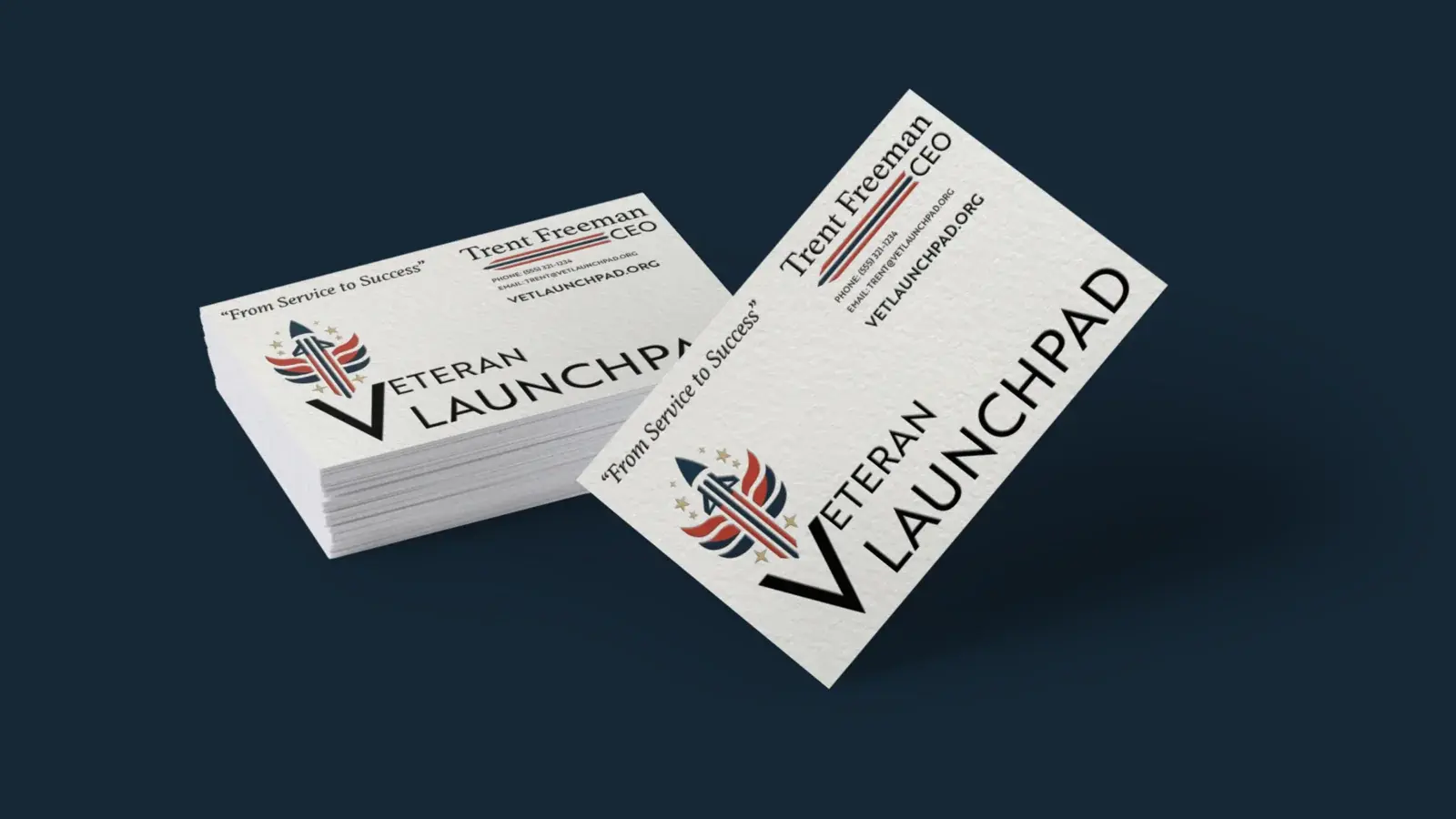 Stacked Veteran Launchpad business cards on a navy ground, printed with the tagline From Service to Success.
